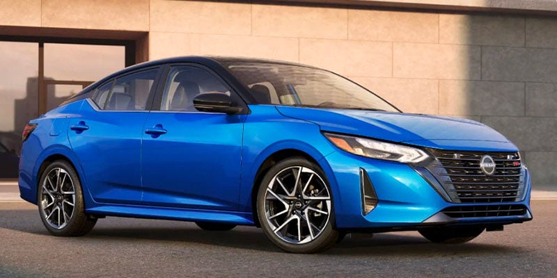 2025 Nissan Sentra parked next to a building